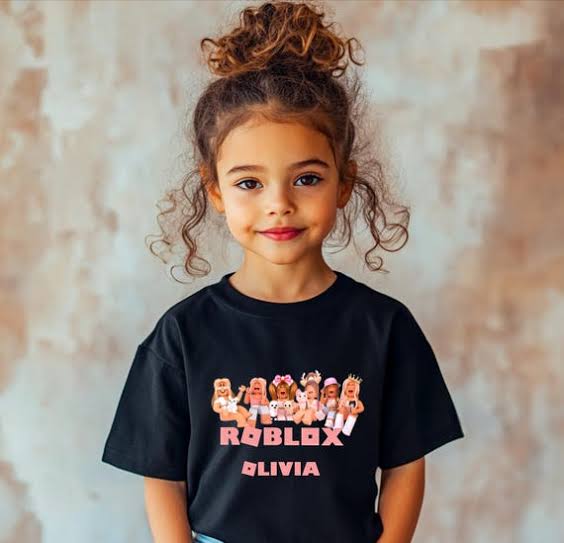 Young girl wearing a black t-shirt with a Roblox character group graphic and the personalized name Olivia